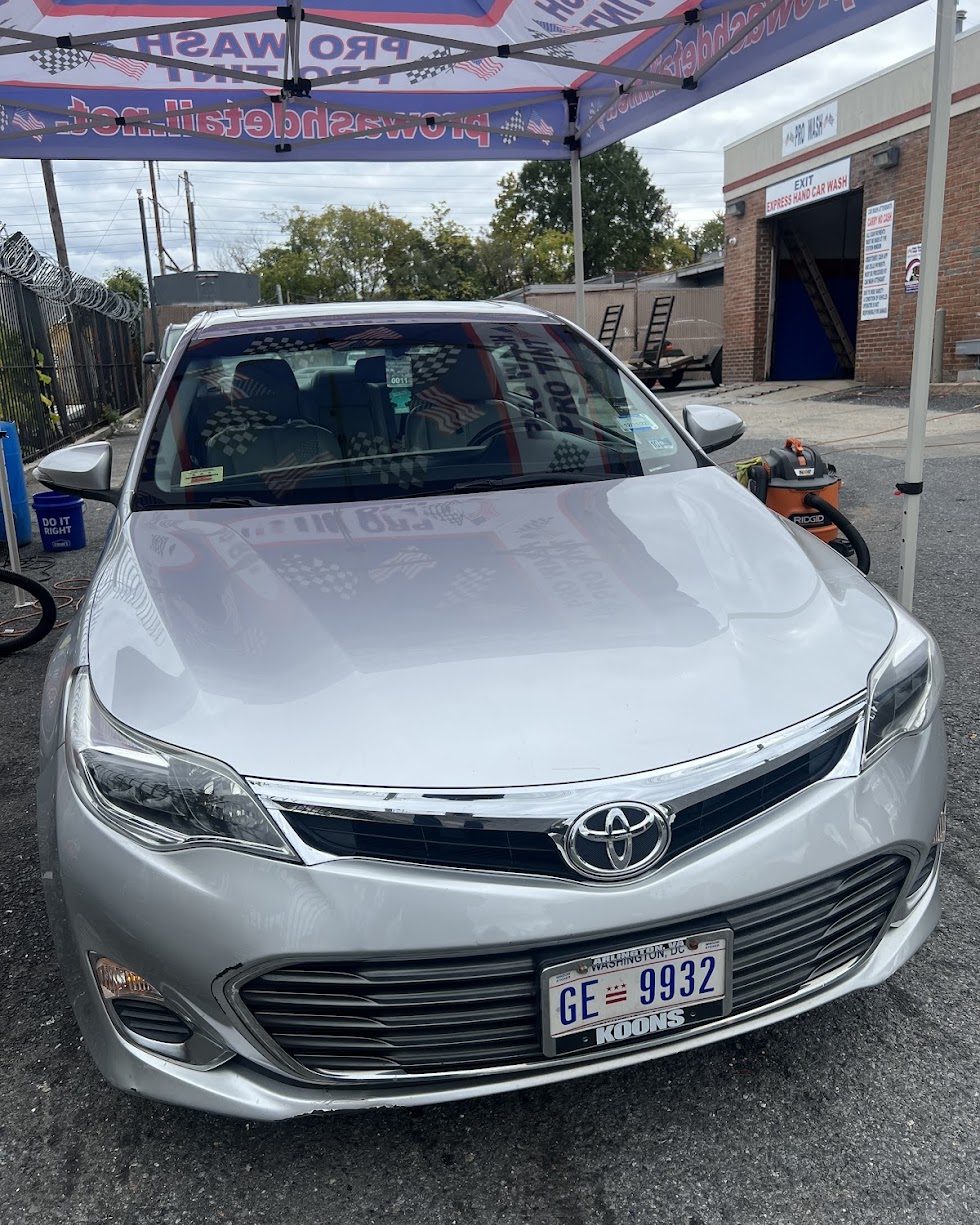 Silver Toyota Avalon under the Pro Wash canopy beside the express hand car wash bay on Kenilworth Ave NE